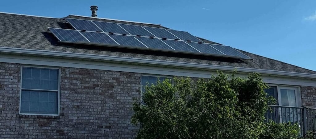 Solar panels soaking up the sun above Cambridge Place Apartments, supporting green living in Iowa City
