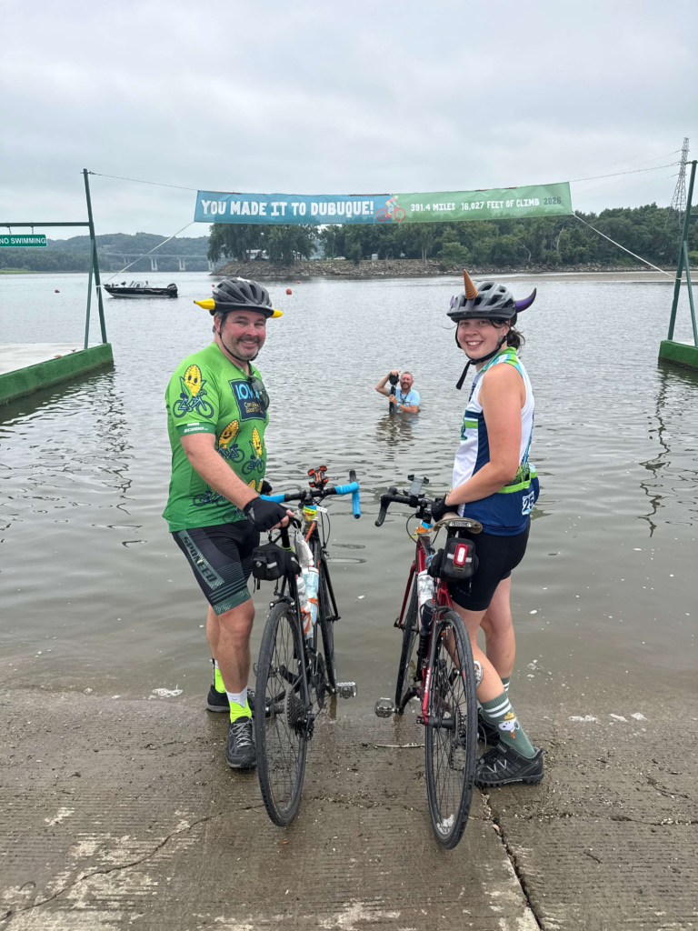 Two RAGBRAI riders posing with their bicycles during the ride across Iowa